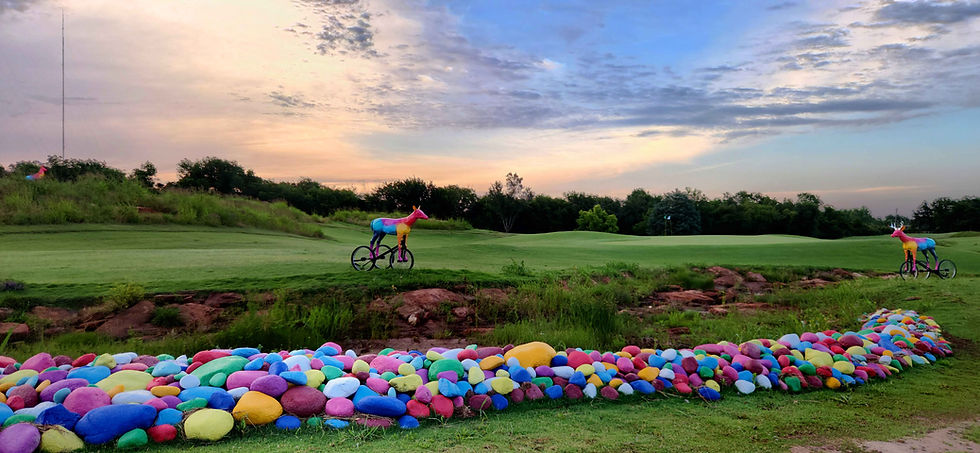 River Run: a ninety-foot land art intervention composed of 15 tons of river stone and recycled glass.