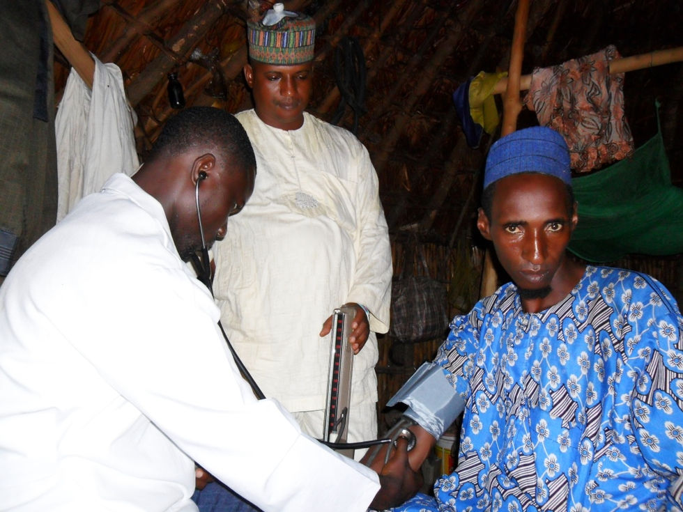 AMC Doctor treating a Fulani man