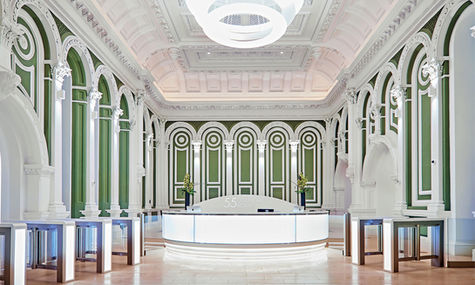 Curved reception desk illuminated with seamlessly integrated Applelec LED Light Sheet