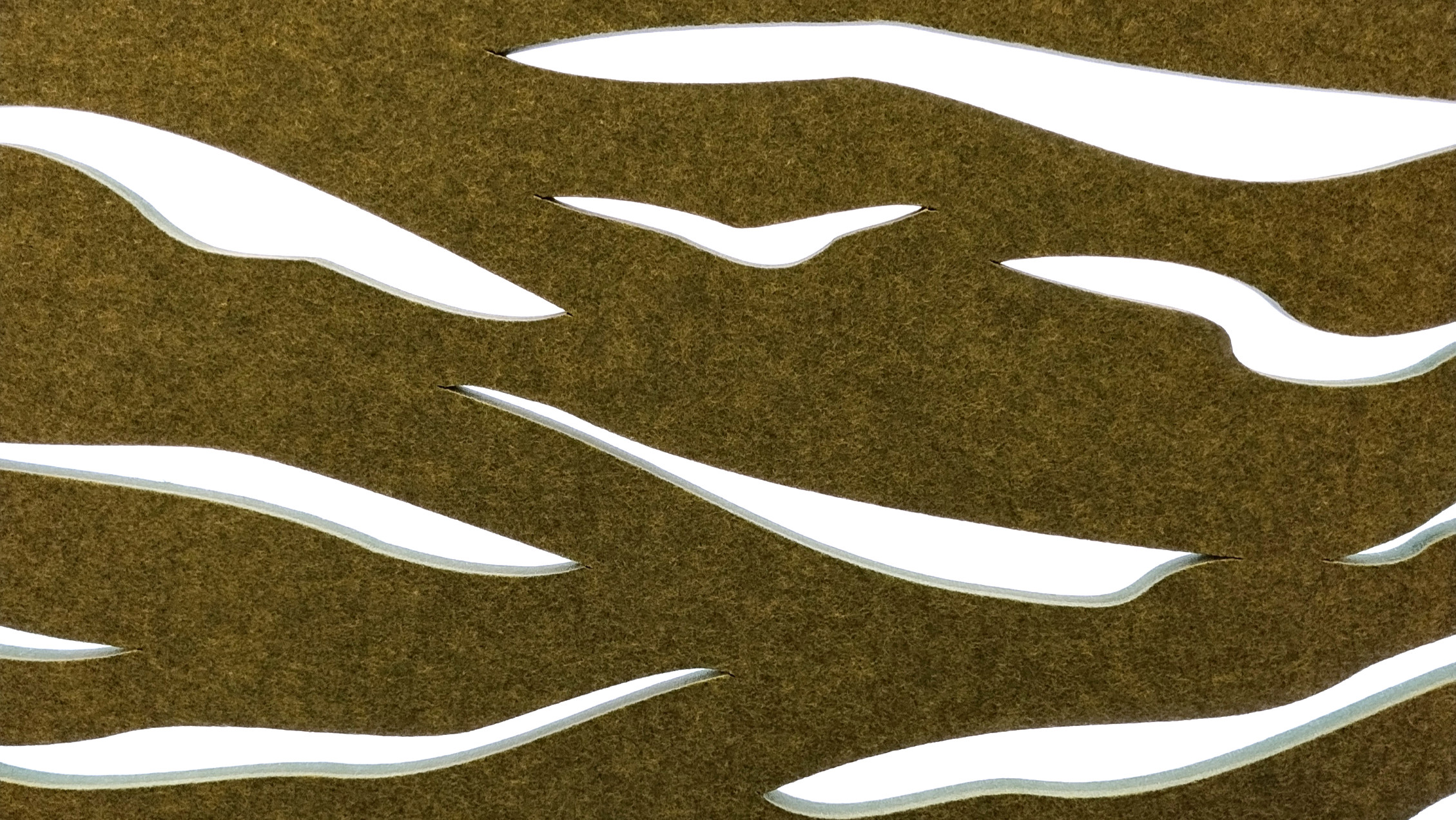 Close-up of an Applelec Interiors LumiSorb acoustic panel with flowing, nature-inspired cut-outs and soft integrated illumination.