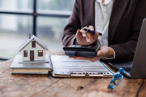 mortgage loan officer performing calculations at desk