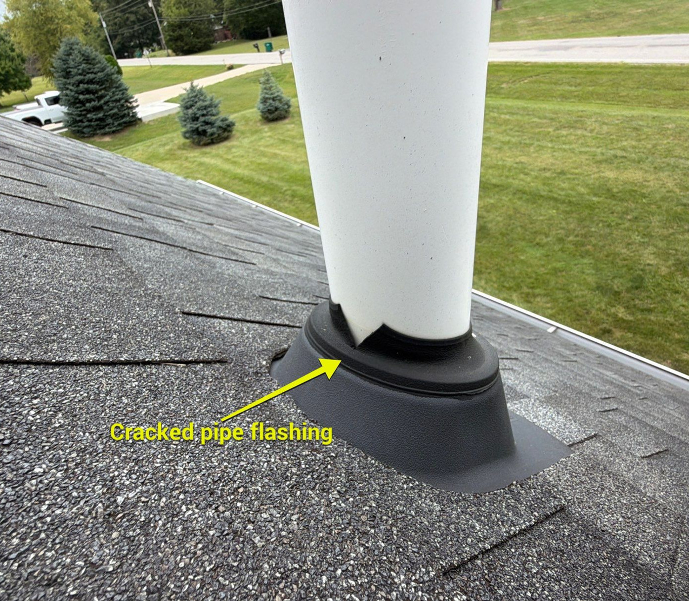RoofCo project photo highlighting cracked pipe flashing around a PVC vent pipe, a common cause of autumn roof leaks.