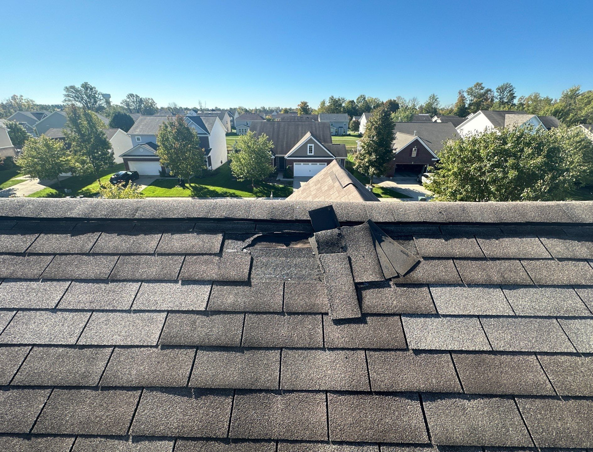 Missing shingles after storm damage in Indianapolis
