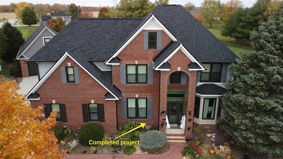 A residential home featuring bright, newly installed white fascia boards and vented soffit panels along the roofline.