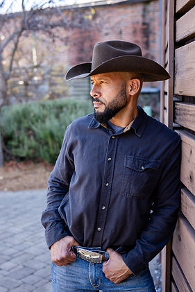 Vaquero Landworks Founder Jose Espejo wearing a cowboy hat and black button up shirt.