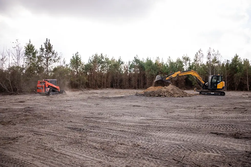 Open, cleared land during brush and tree removal on a private property by Vaquero Landworks in Lyons, Georgia.