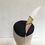 Thumbnail: Black Beret Striking Hat with Geometric Rose Gold and Gold Pointed Feather with