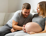 happy-father-touching-pregnant-wife-belly.jpg