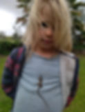 A picture of Limor's son with a lizard on his shirt