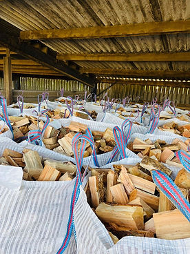 Warehouse with bulk bags full of seasoned firewood