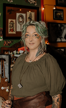 Lauren Vaughan - Goldeneyes Tattoo. Owner of Rose of the West Tattoo in Colorado Springs. Antique american traditional tattooing. 