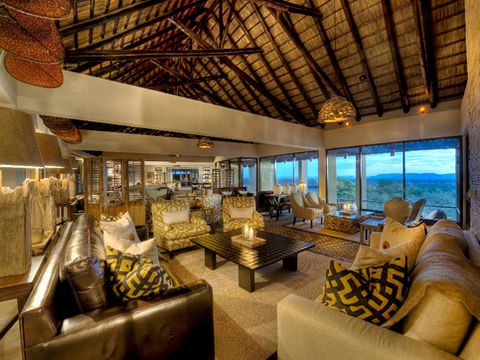 Luxury lodge lounge with traditional thatched roofing in the Serengeti, Tanzania