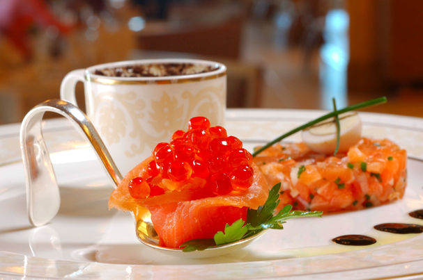 Gourmet appetizer featuring salmon roe and salmon tartare.
