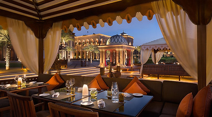 Outdoor dining at Emirates Palace Mandarin Oriental at dusk