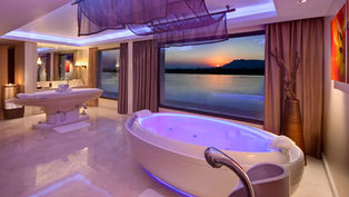 Luxurious spa bathroom with view of the Nile River at sunset