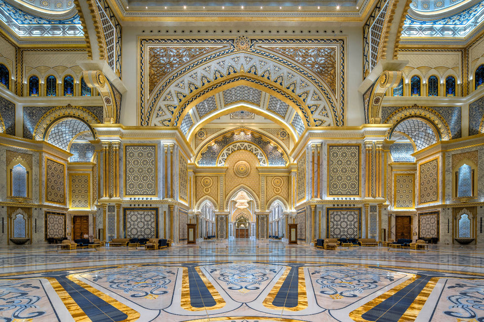 Qasr Al Watan Palace interior with golden arches and intricate patterns. UAE landmark.