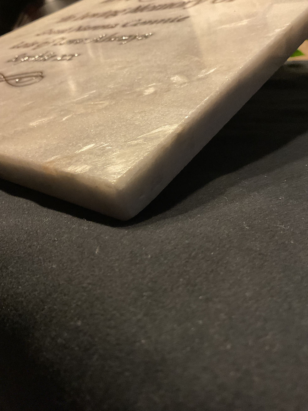 Thumbnail: Side view showing the personalised engraved marble shinning in the light
