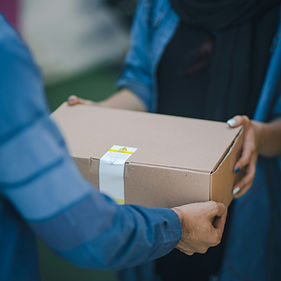 Package being hand delivered to a customer