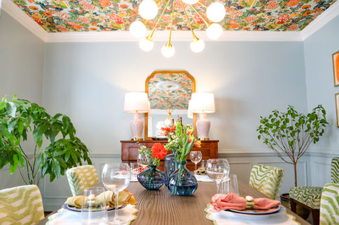 Colorful lighting and mirror centerpiece dining area