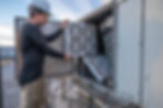 HVAC mechanic doing an air filter change on a commercial make up air unit.jpg