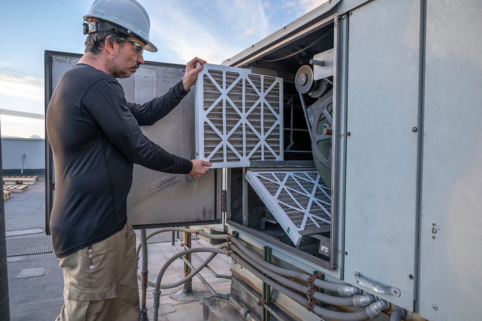 HVAC mechanic doing an air filter change on a commercial make up air unit.jpg