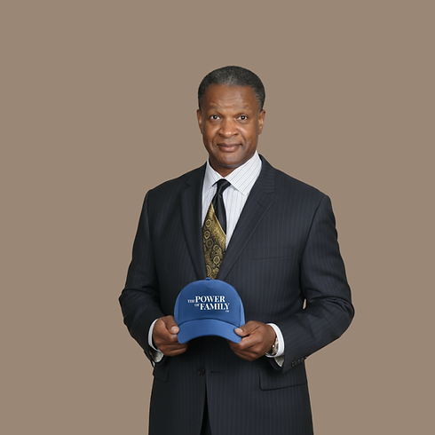Terry holding the blue cap.png