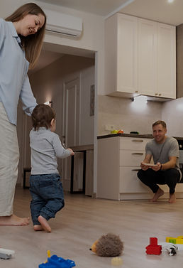 full-shot-parents-watching-kid-s-first-s