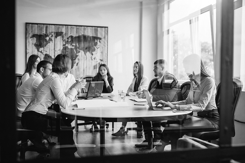 group-of-people-working-out-business-plan-in-an-office.png