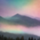 rainbow clouds over misty mountains