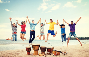People jumping on beach at rhythm retreat.png
