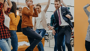 Happy team celebrating success in office