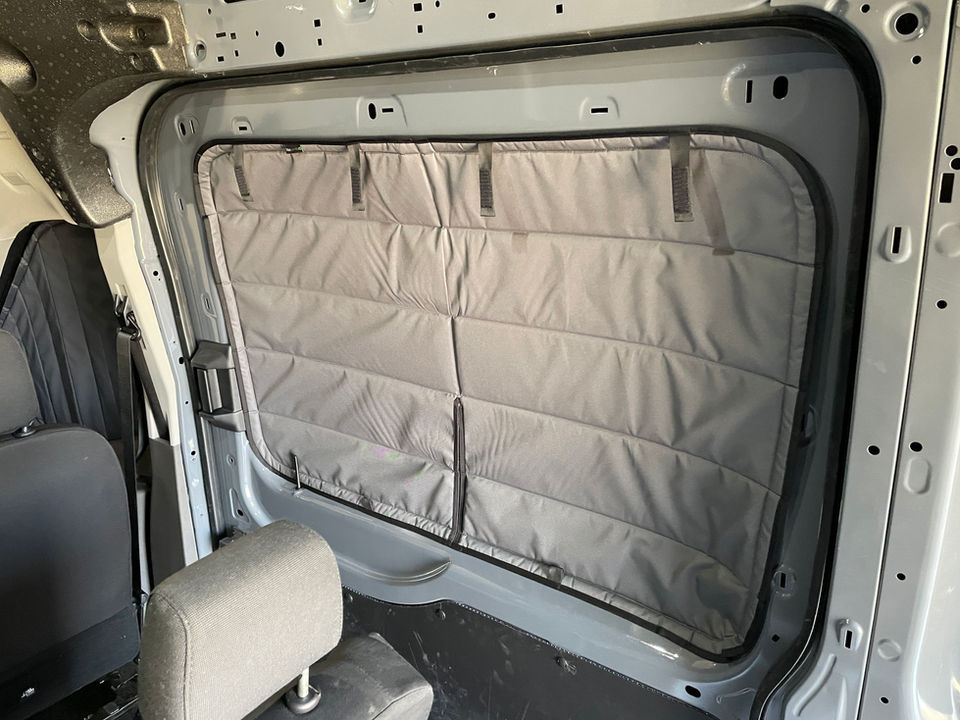 Grey van window insulation panels installed