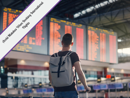A person wearing a backpack stands in a busy airport, looking up at a large electronic departure board. The text "Avoid Mistakes When Booking International Flights" is overlaid on a purple diagonal banner in the upper left corner.
