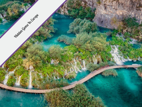Aerial view of turquoise lakes, lush greenery, and cascading waterfalls connected by a wooden boardwalk in a scenic European nature reserve. Text overlay in the top left corner reads "Hidden Gems in Europe."