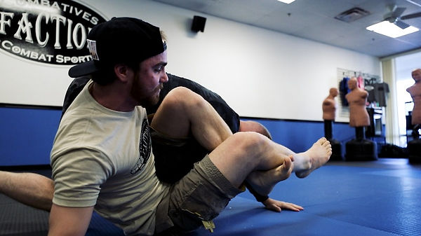 BJJ classes in Mesa AZ no gi - coach Maiston demonstrates the omoplata jiu jitsu move