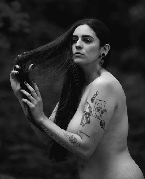 A monochrome, topless, implied nude portrait of Misuzu