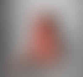 Misuzu sat on a plastic sheet on the floor covered in fake blood, licking the blood off her hands