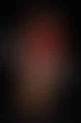 Misuzu poising on set in a red lace top with Pixie around her legs