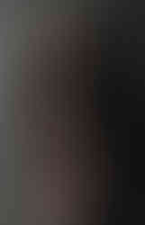 Misuzu wearing a black lace bodysuit, stood in front of a corrugated iron back ground