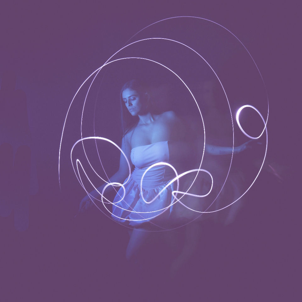 Misuzu using a torch on a long exposure shot to create shapes in light. Edited to add a pink hue