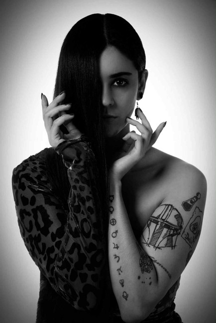 Monochrome portrait of Misuzu in a one sleeved dress. Hair covering her face on the sleeved side.