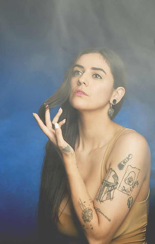 Portrait of Misuzu in the studio using a smoke machine, looking into the light