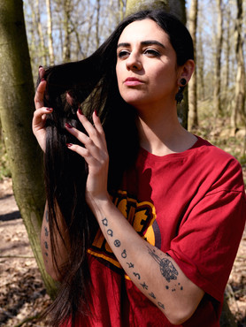 Close up portrait of Misuzu in casual clothing in the woodland