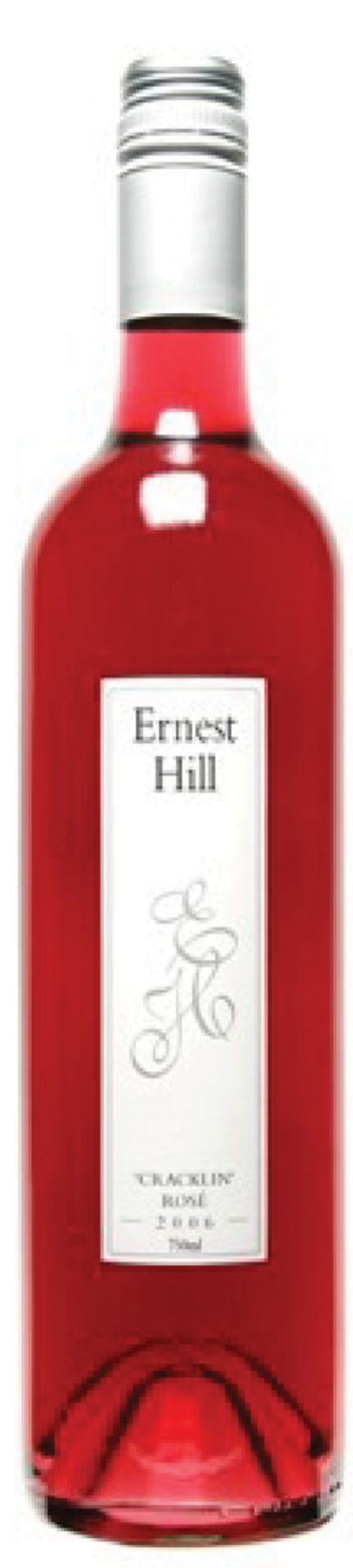 Red wine bottle labeled "Ernest Hill Cracklin' Rosé." White label, silver cap. Elegant design, displaying winemaker's logo.