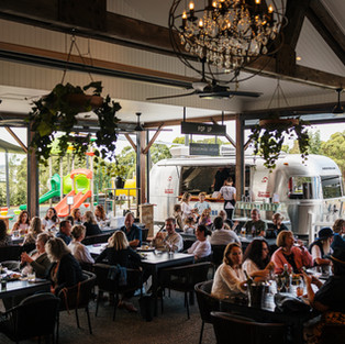 PEOPLE SITTING AT nineteen BEER GARDEN