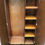 Thumbnail: An English Art Deco single figured walnut wardrobe on stepped plinth