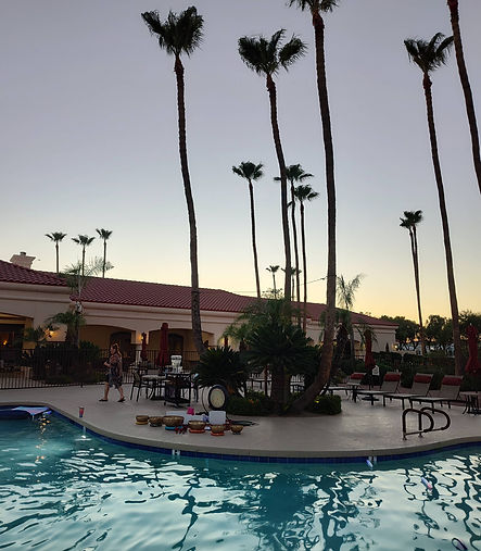 The pool at Las Palmas. Residents preparing to experience a sound healing while at the pool.