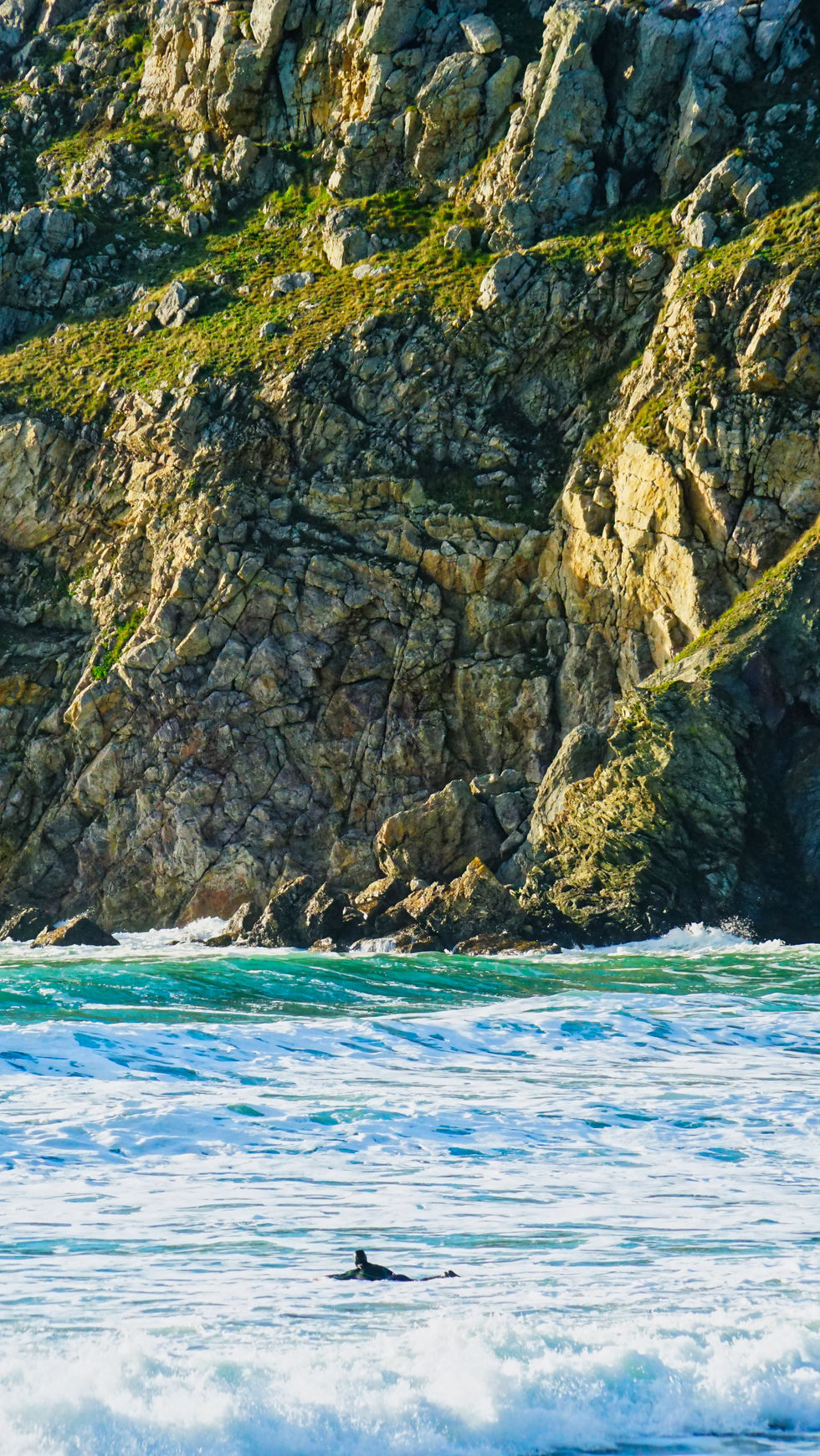 surfer and cliff