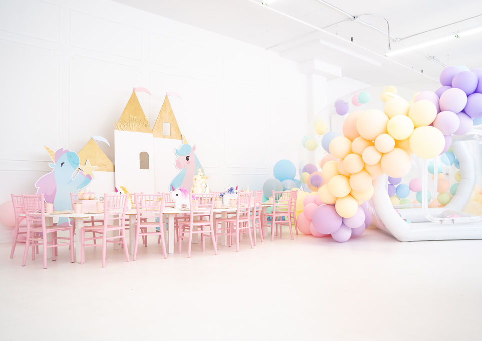 A unicorn theme party in a white venue
