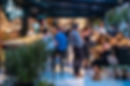 Eye-level view of a 4Beer franchise bar with taps and wooden tables